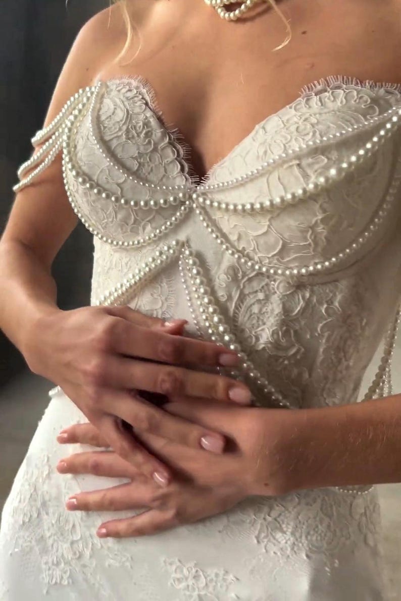 Pearl Beaded Spaghetti Strap Off The Shoulder Sweetheart Scattered Floral Lace Trumpet Bridal Gown With Draping Pearl Beading Detail