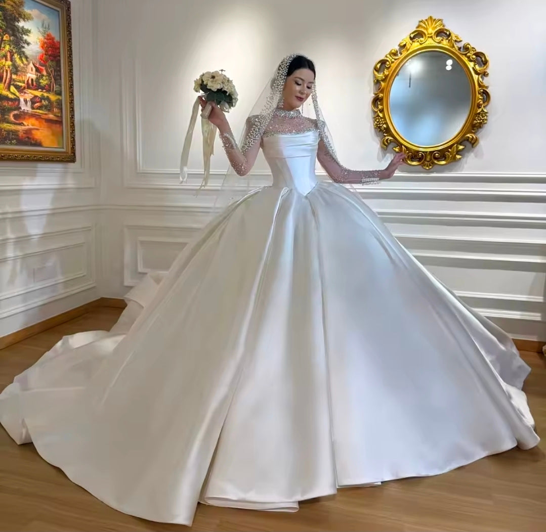 Modern And Modest Mikado Satin Strapless Beaded Neckline A-Line Gown With Long Sleeve Beaded Jacket.
