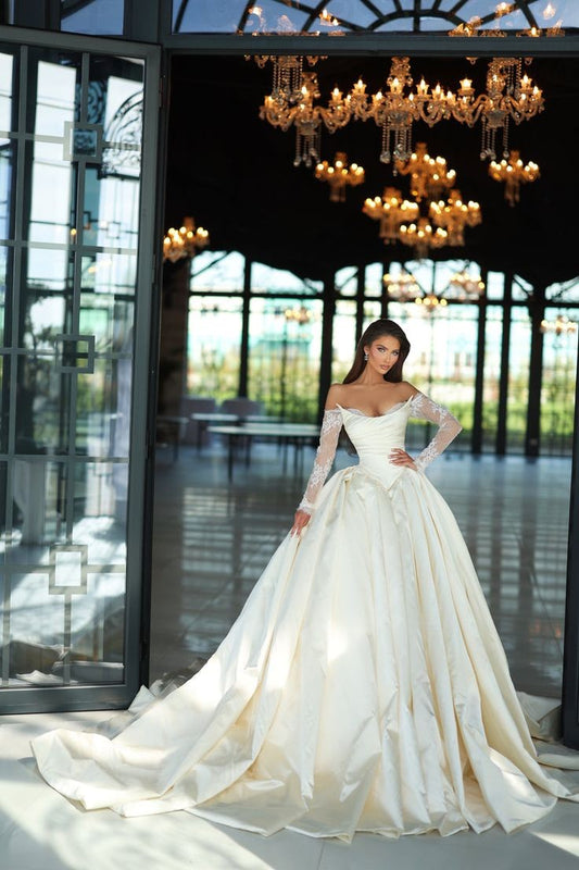 Off The Shoulder Lace Long Sleeve Sculpted Bodice And Pleated Skirt Wedding Gown