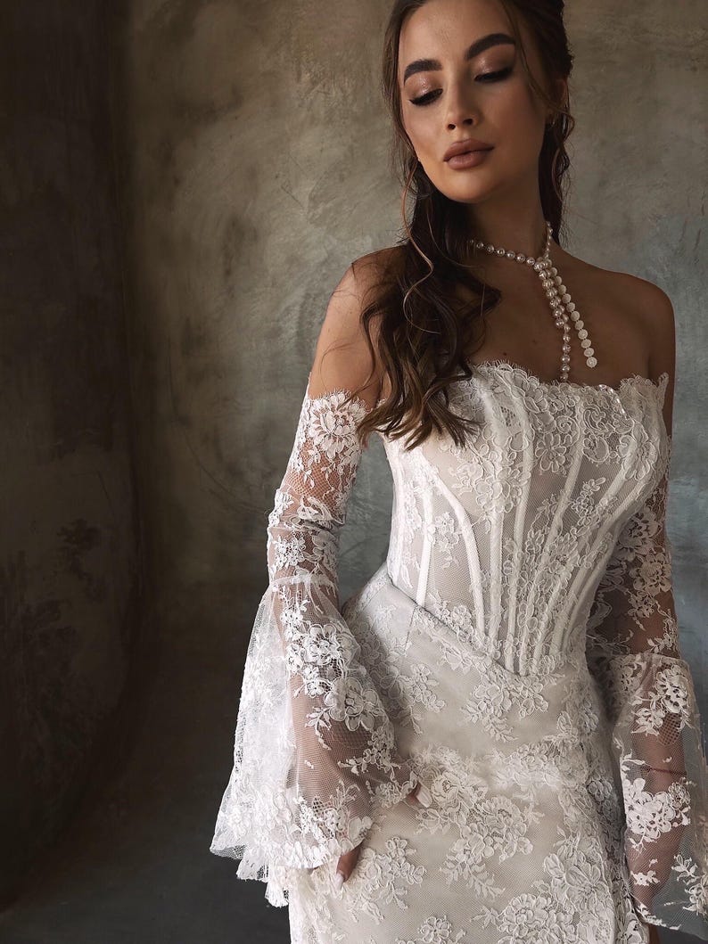 Breathtaking Scattered Floral Lace Corset Inspired Boho Themed Trumpet Bridal Gown With Matching Detached Flare Sleeves