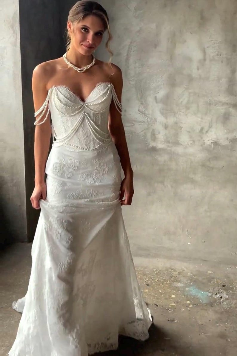 Pearl Beaded Spaghetti Strap Off The Shoulder Sweetheart Scattered Floral Lace Trumpet Bridal Gown With Draping Pearl Beading Detail