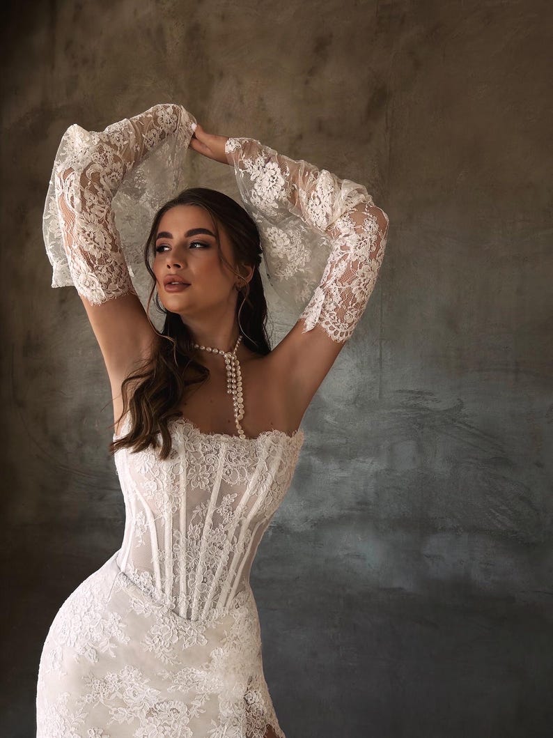 Breathtaking Scattered Floral Lace Corset Inspired Boho Themed Trumpet Bridal Gown With Matching Detached Flare Sleeves