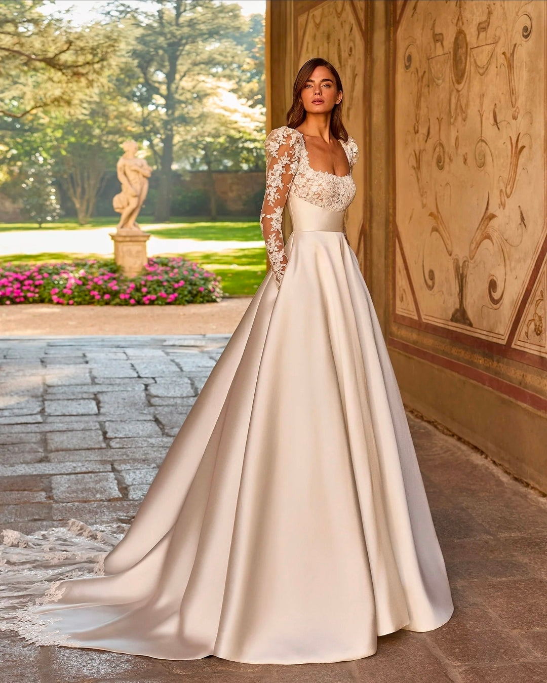 Classically Romantic Long Sleeve Lace Square Neckline With Mikado Waistline And Skirt And Lace Trimmed Train Detail A-Line Gown